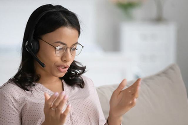 Lady with headset speking on the telephone